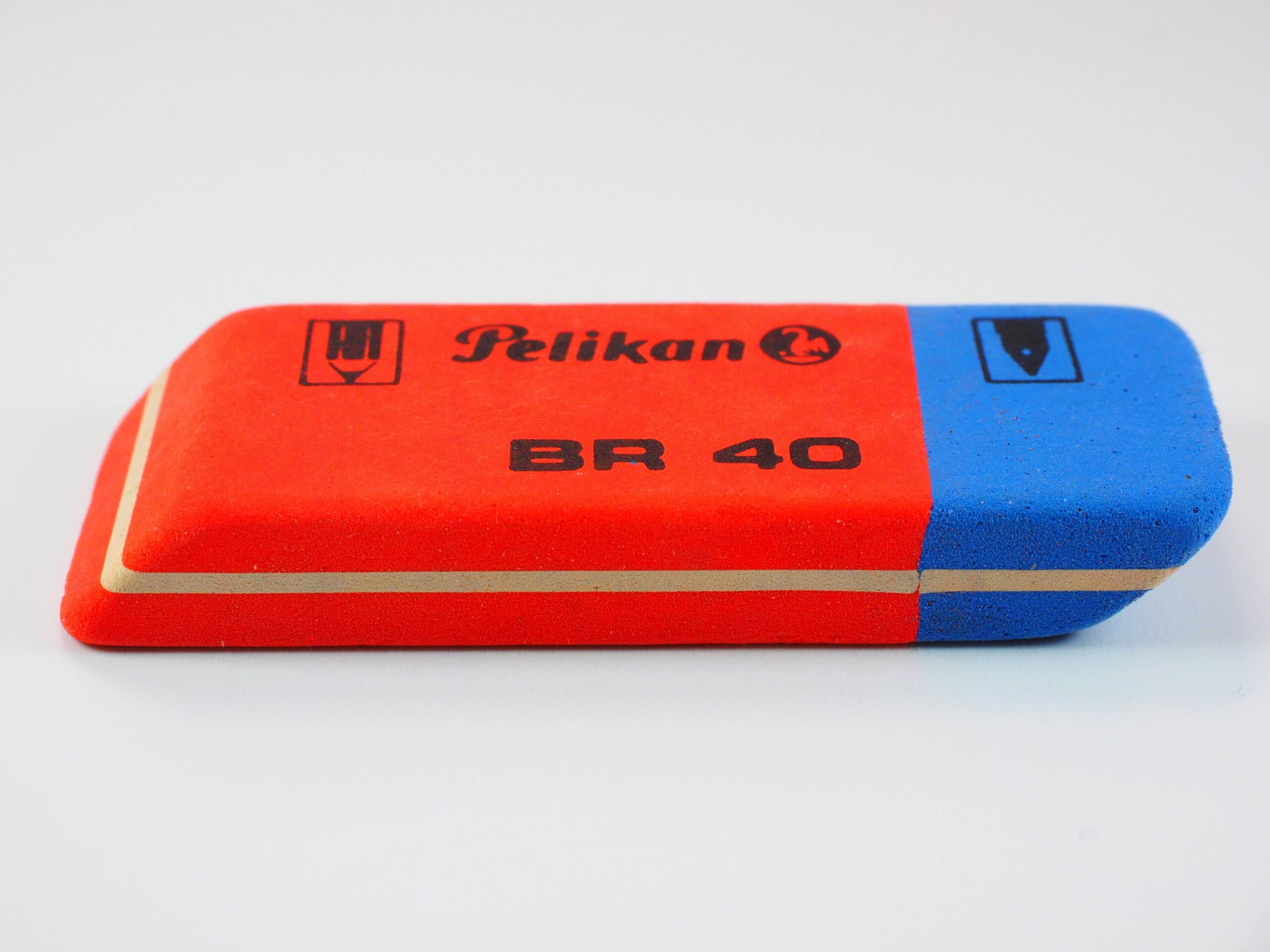 Close-up of a red and blue Pelikan BR 40 eraser, perfect for office supplies. freelancing mistakes